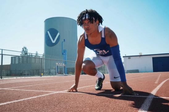 A photo of Augusta Cheek getting ready to run on the SBVC track.