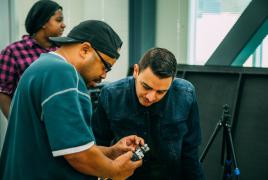 Students working with a Zoom recorder. 