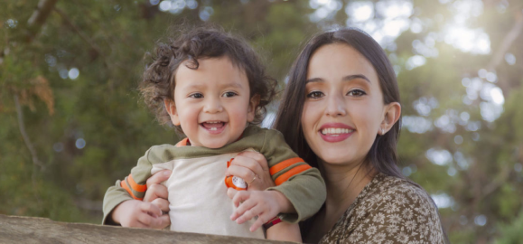 A picture of a mother and daughter smiling